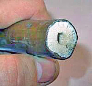 scaled hot water pipe